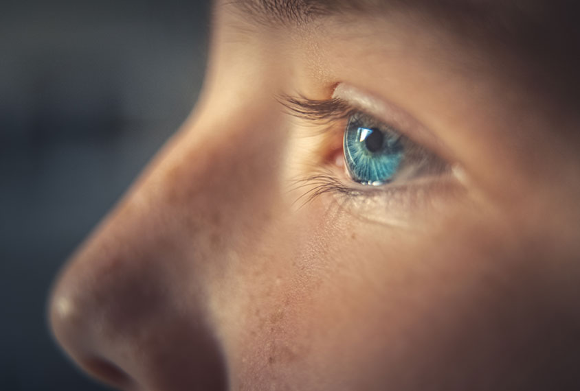 Close-up profile of child with focus on eye.