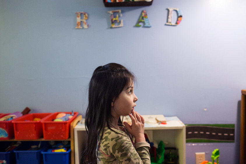 Izzy Green watches a children's television show at a home daycare in Madrid, Iowa on Thursday, January 19, 2017. KC McGinnis for Spectrum