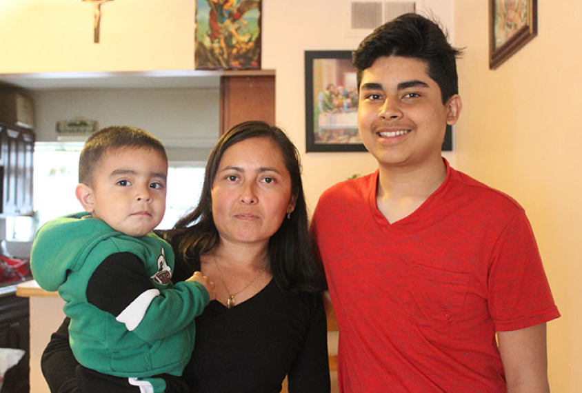 Mother with two sons at home