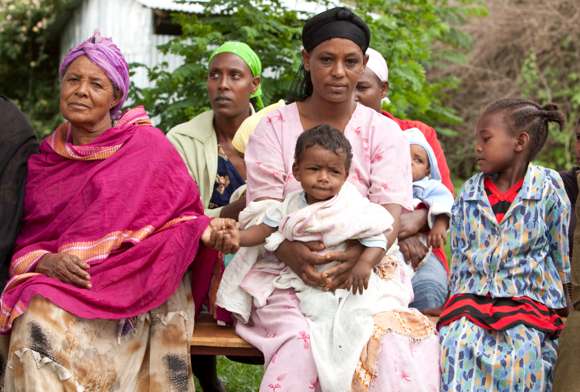 An Ethiopian family sitting for a portrait.