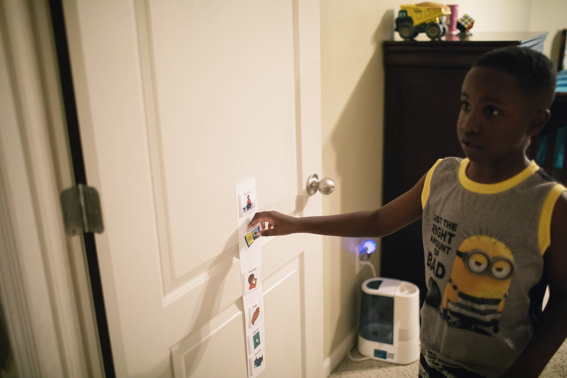 child placing sticker on door