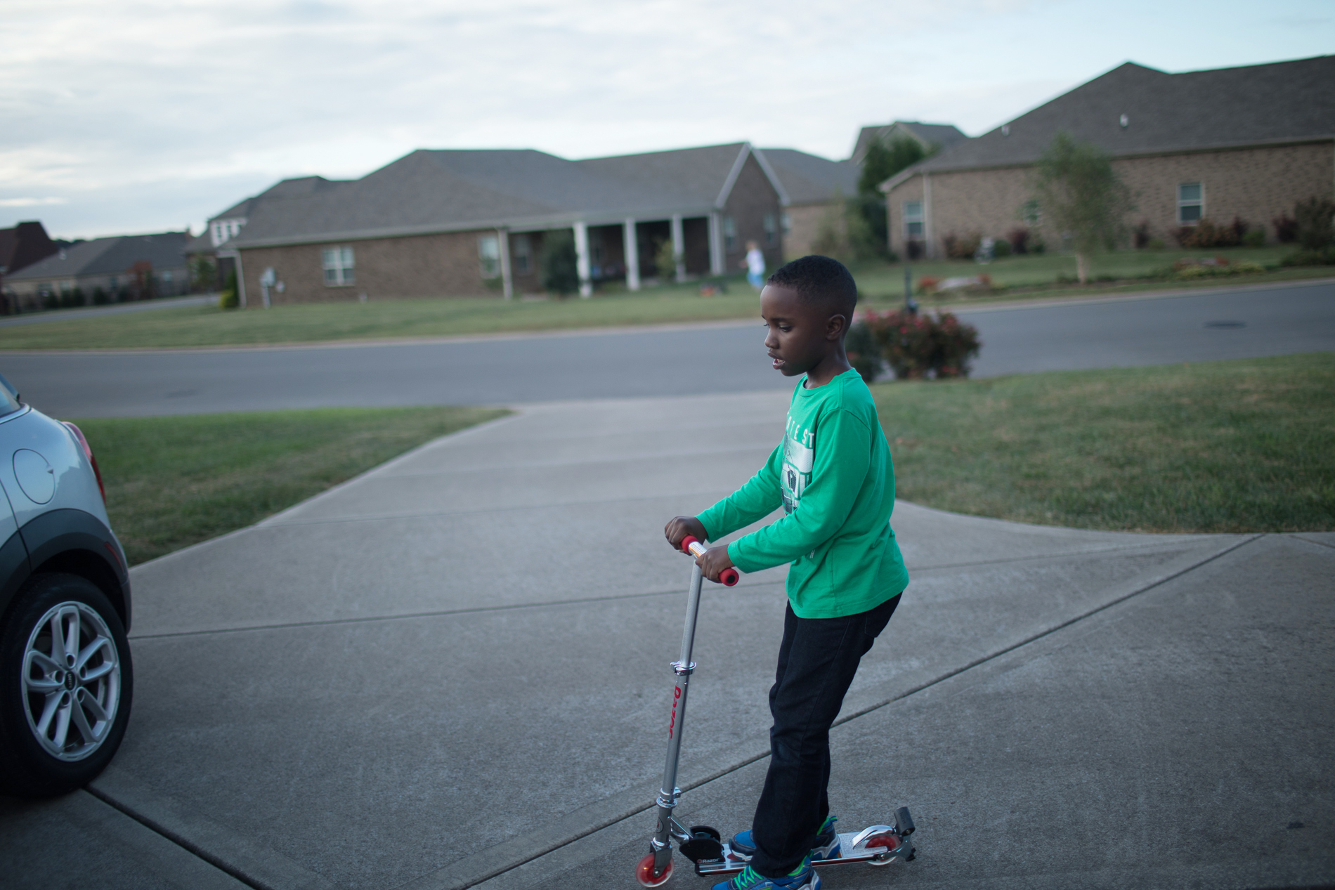 child on scooter