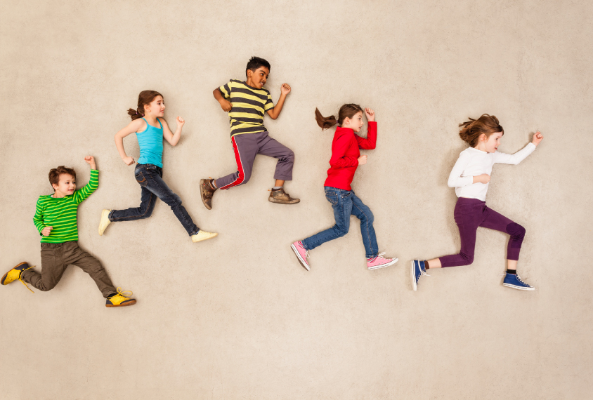 birdseye view of five children in running formation