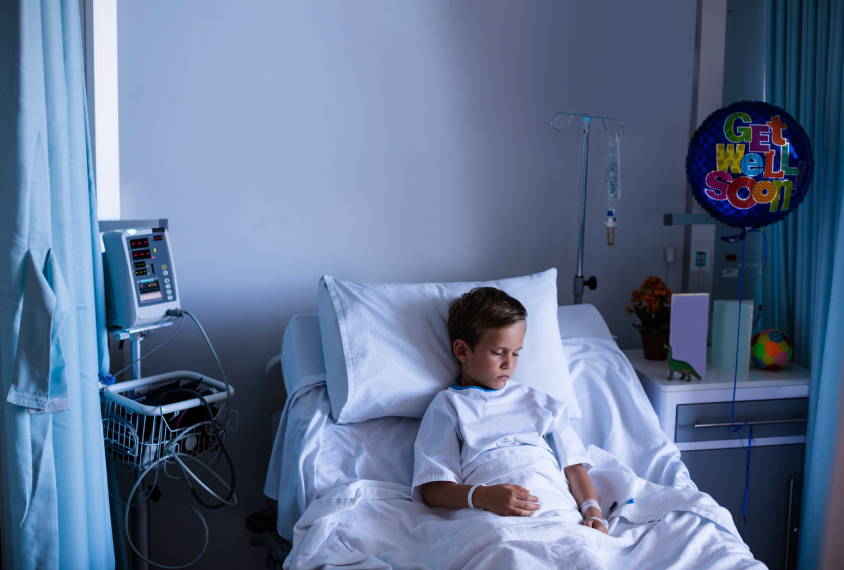 Boy in hospital bed