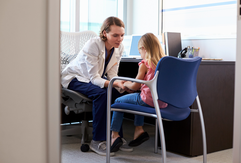 Child with doctor in office