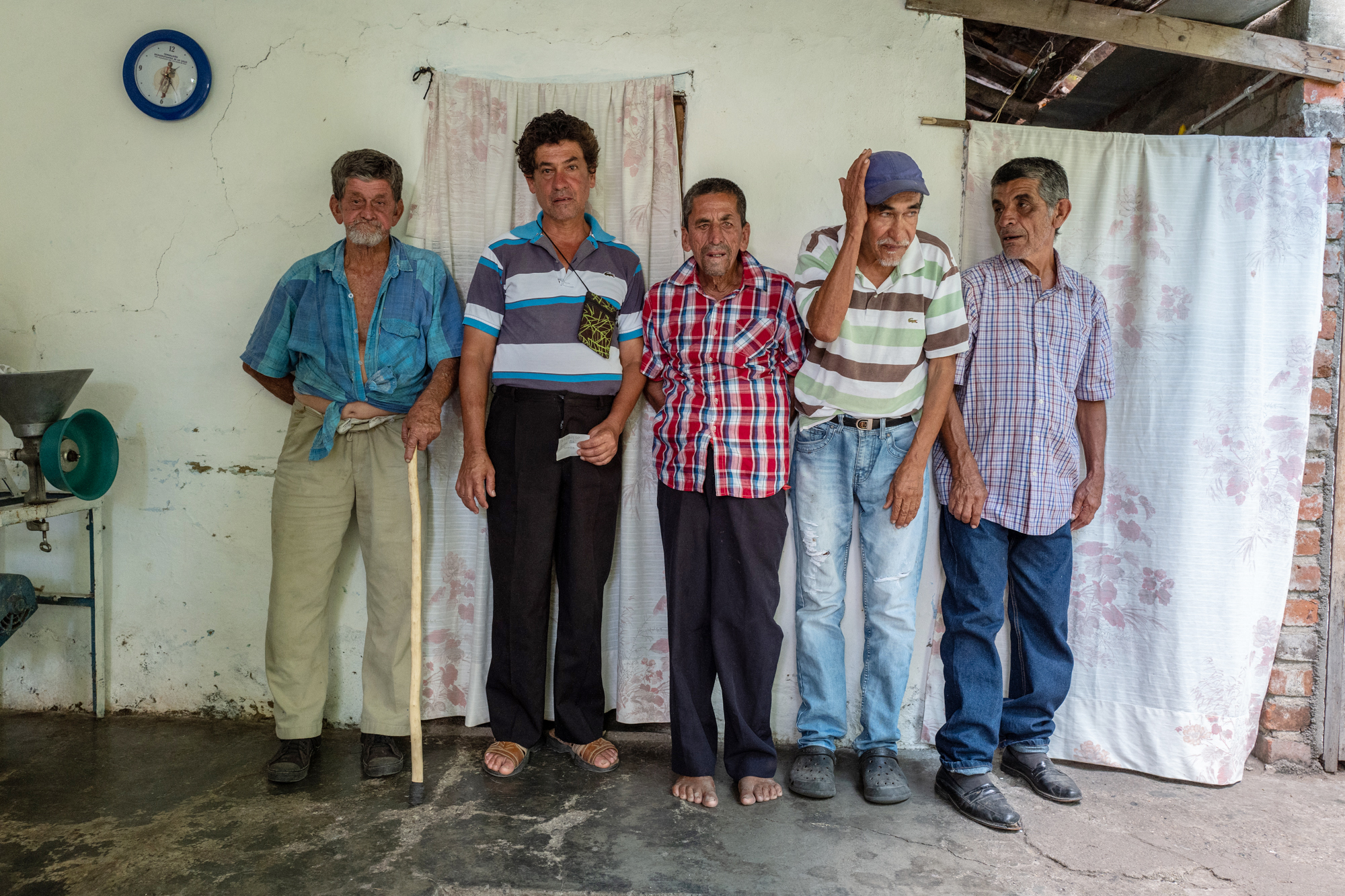 Group of men pose for a portrait.