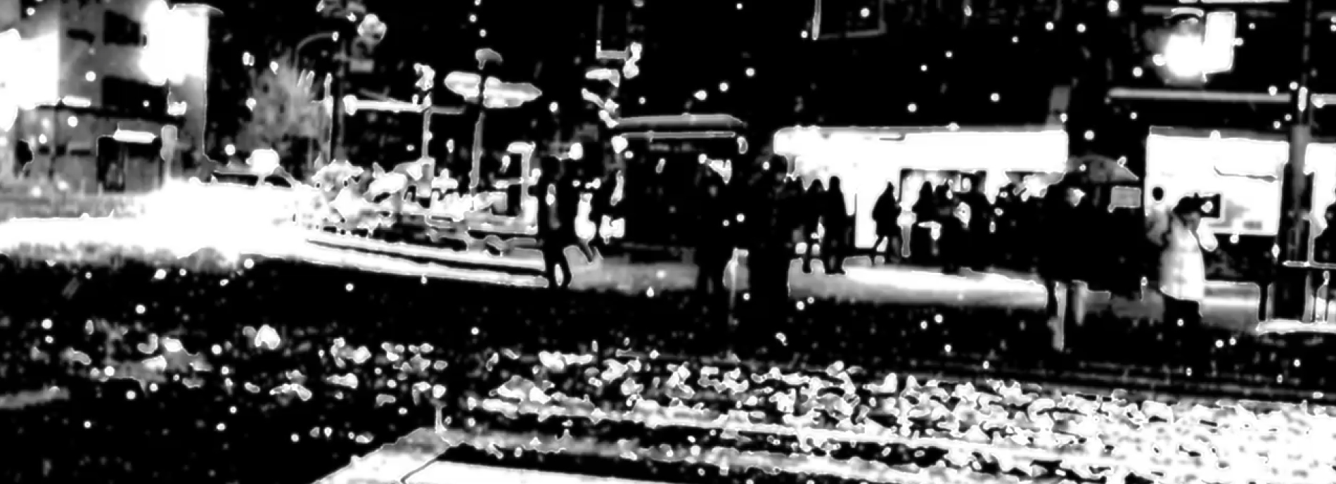 Black and white street scene with high contrast and fragmentation to show possible experience of person with autism.