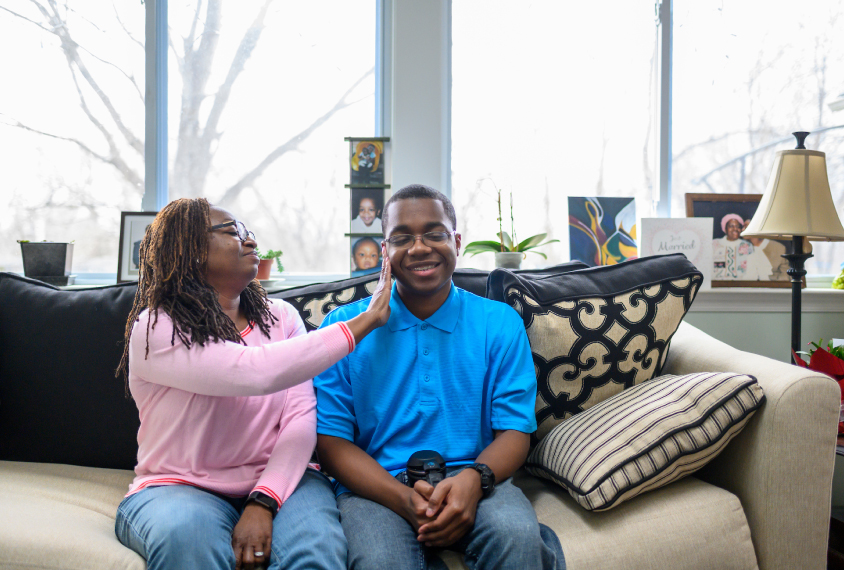 Wendy Shaia affectionately touches her son John's cheek.