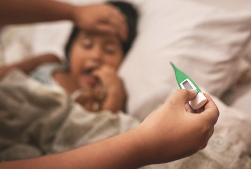 Child having temperature taken