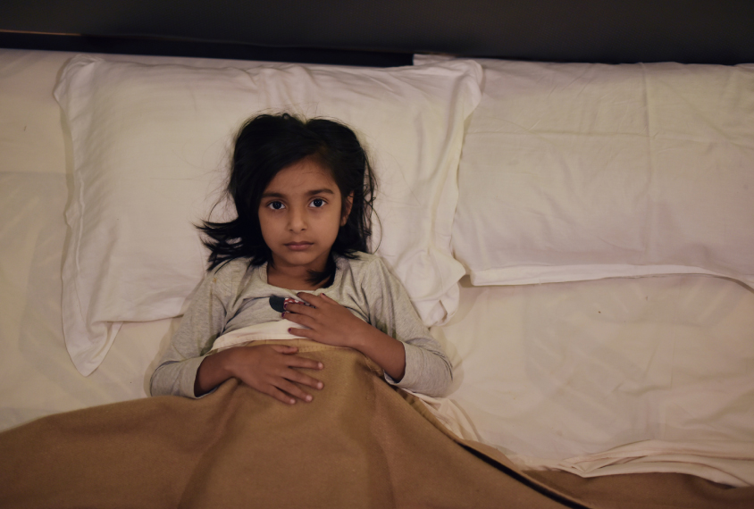 Young girl sleeping in the bed