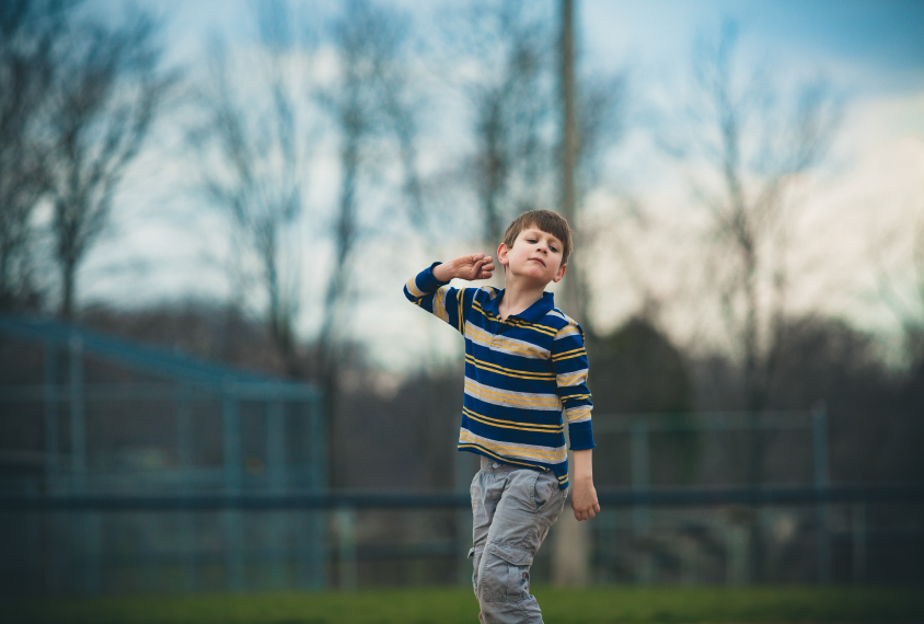 an autistic boy in a field