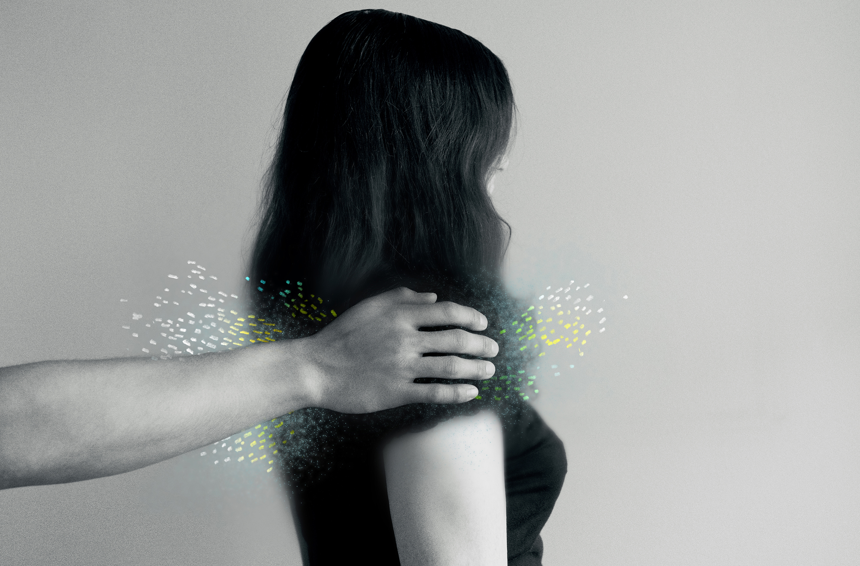 Photo shows a hand touching a woman's shoulder, with illustrated dots highlighting the point of contact.