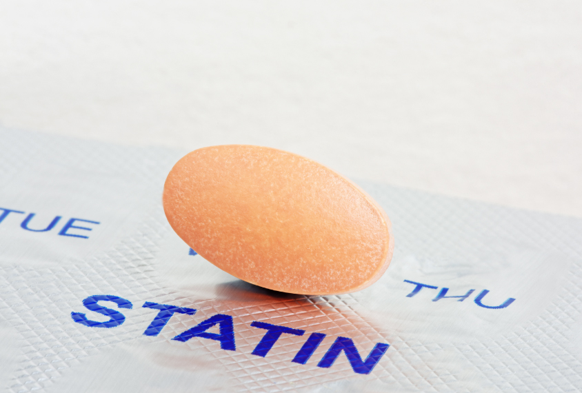 Statin pill rests on blister pack