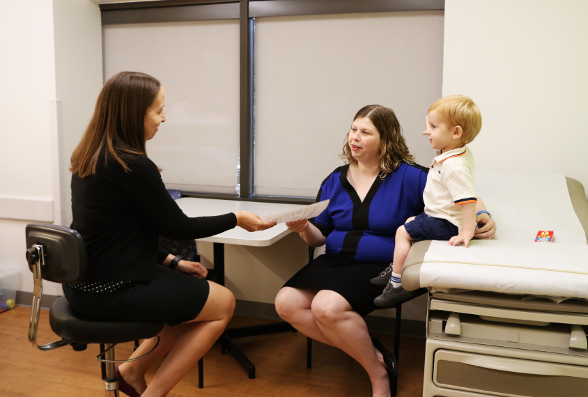 Clinician with mother and child