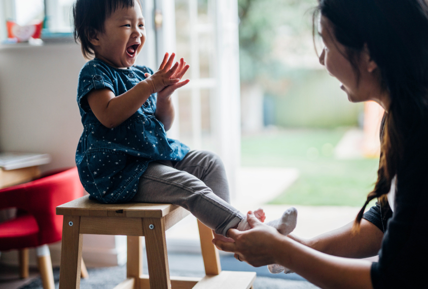 Toddler vocalizing with parent.