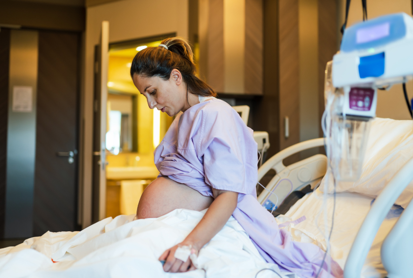 Young woman during birth.