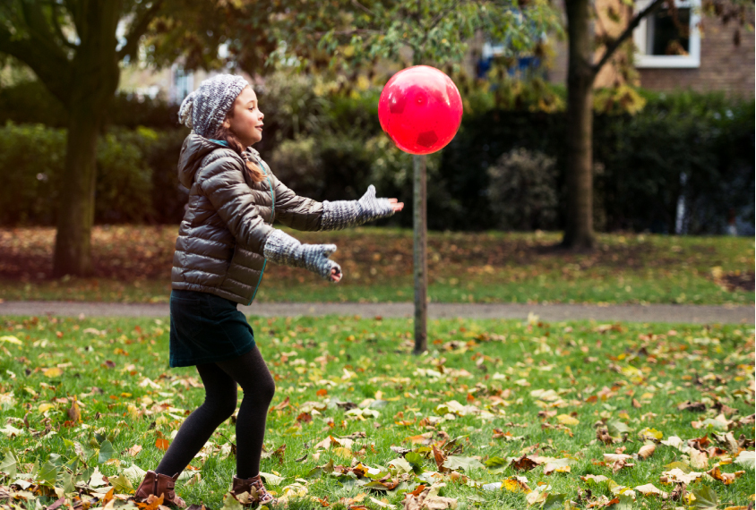 girl about to catch a ball