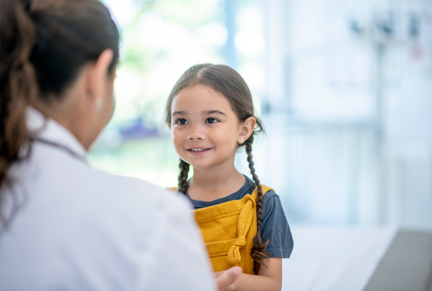 Child with clinician, making eye contact