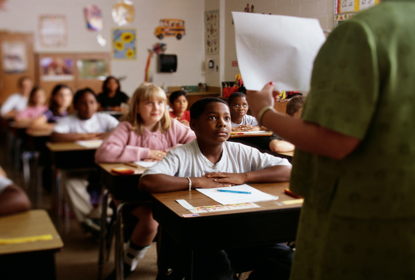 diverse classroom of middle school students during a lesson.