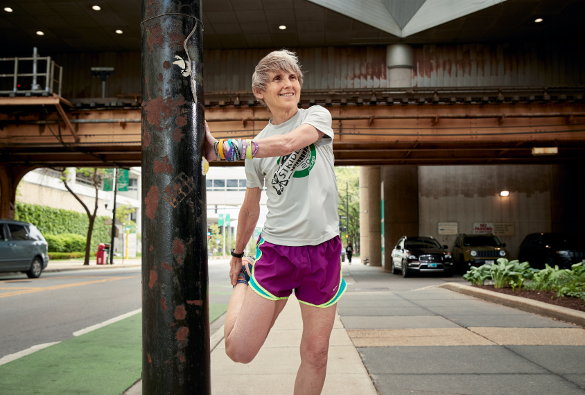 Dr. Elizabeth Berry-Kravis stretching during a run.