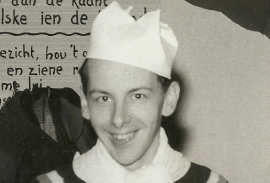 Photograph of Siem as a child, in a party hat.