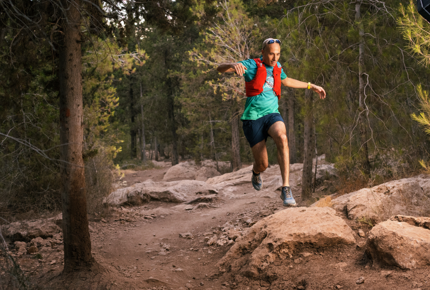 Ofer Yizhar jumps during a trail run.