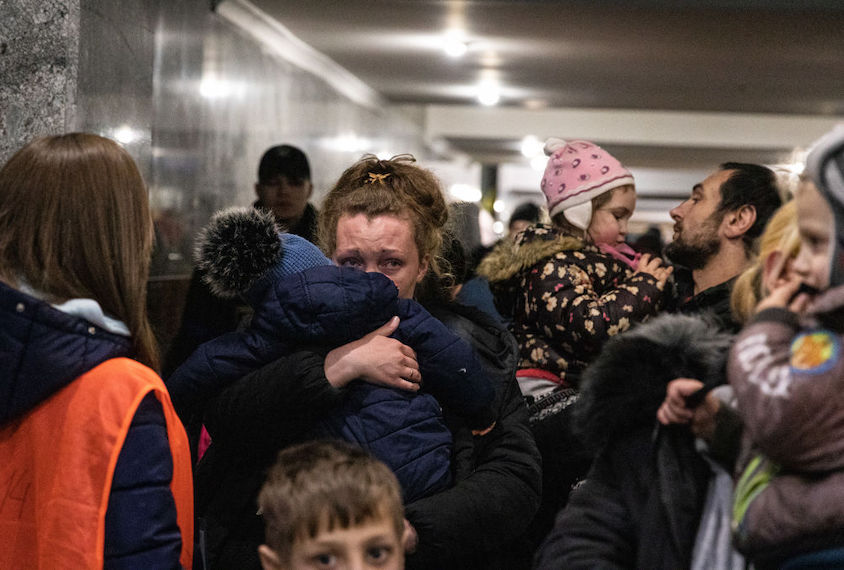 Ukrainian families seen waiting for a train to Poland. Lviv, the largest city in western Ukraine, has now become a transit hub for women and children fleeing to Europe, while men return and travel to eastern Ukraine to defend the country.