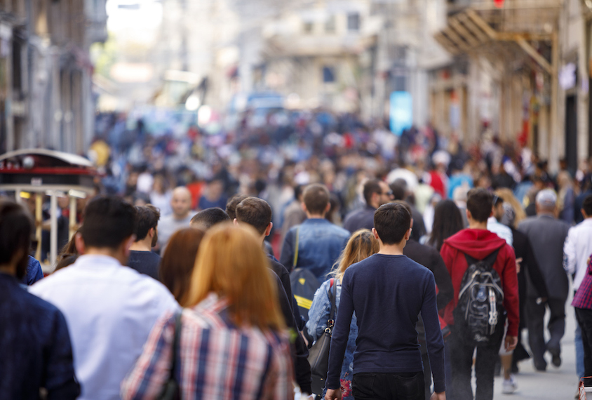 A street crowded with pedestrian traffic