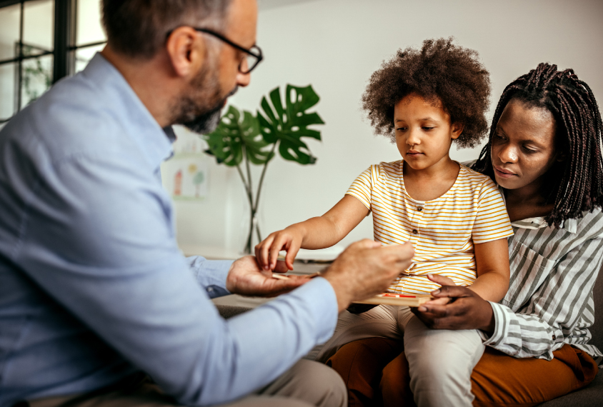 Child with parent and clinician