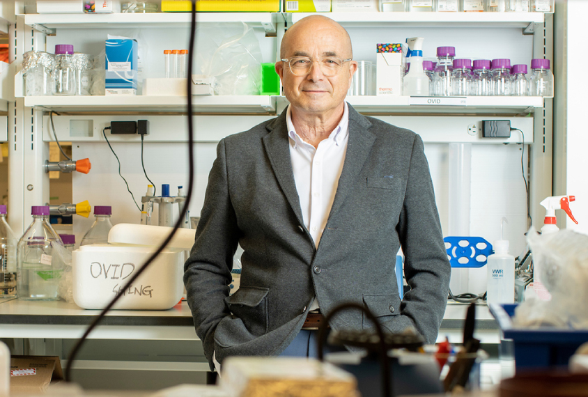 Jeremy Levin, chief executive officer of Ovid Therapeutics, stands against a bench in a lab.