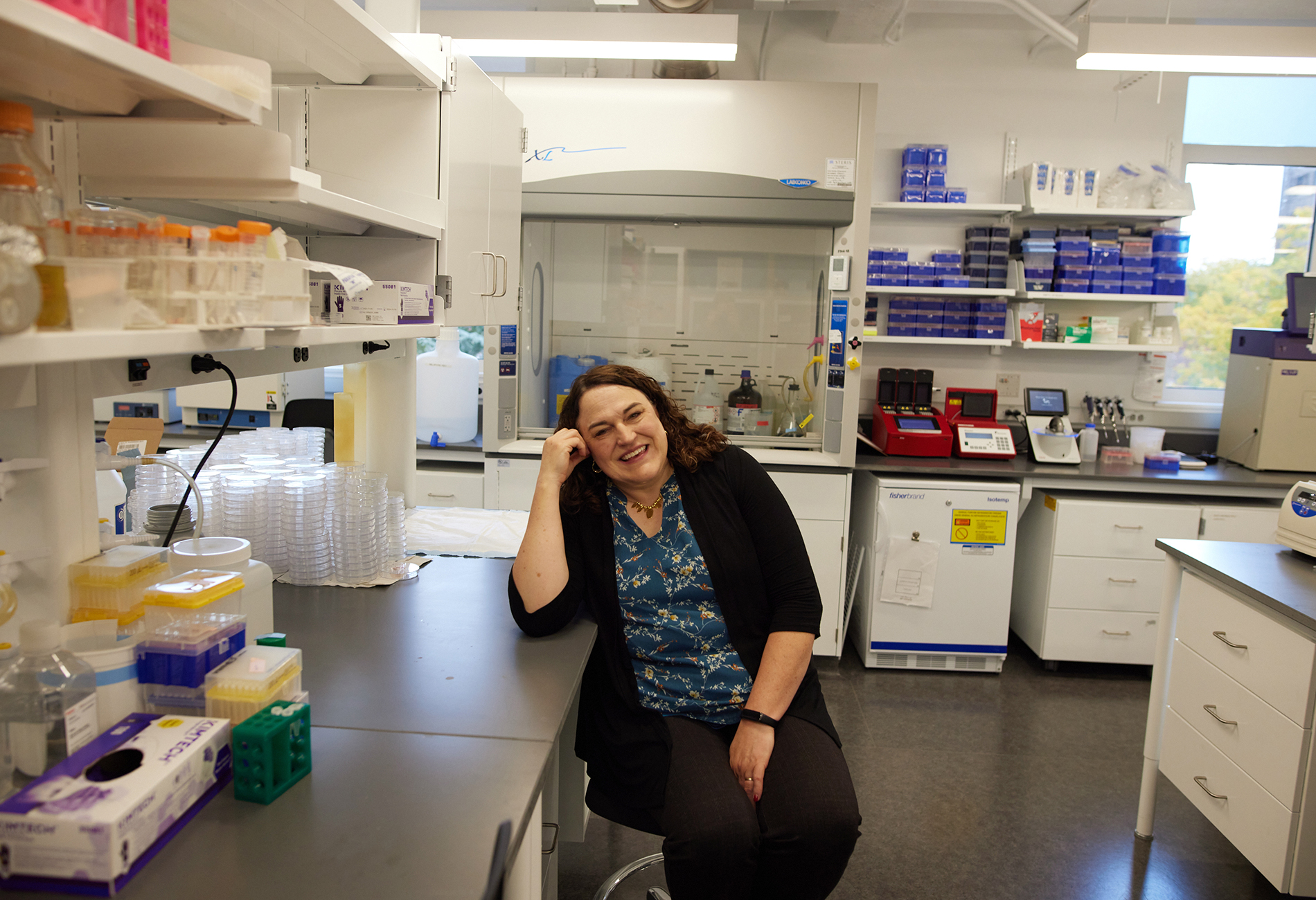 Molecular biologist Rebecca Burdine sits in a lab.