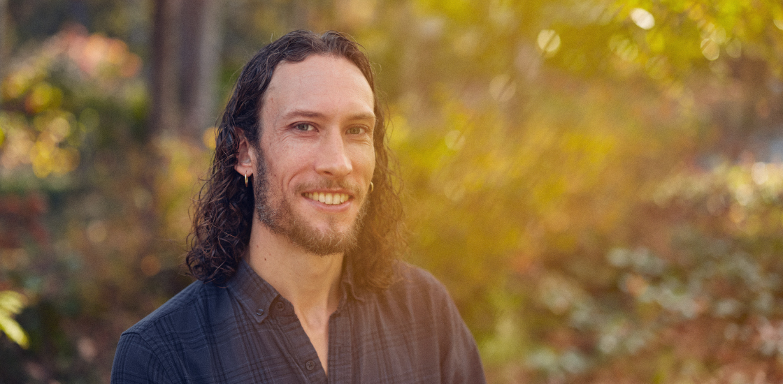 Graham Diering smiles in a portrait in his yard.