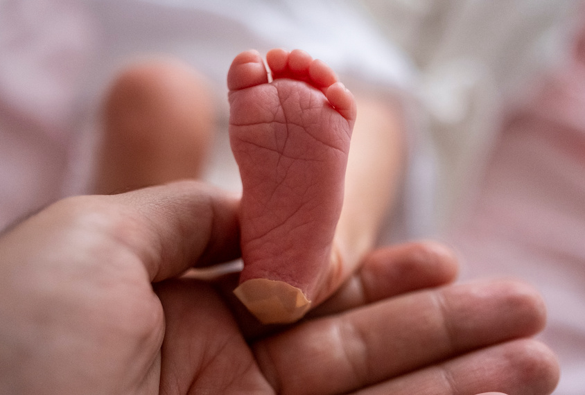 A photograph of an infant's foot.