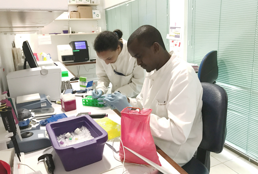 Image of scientists working in a lab.