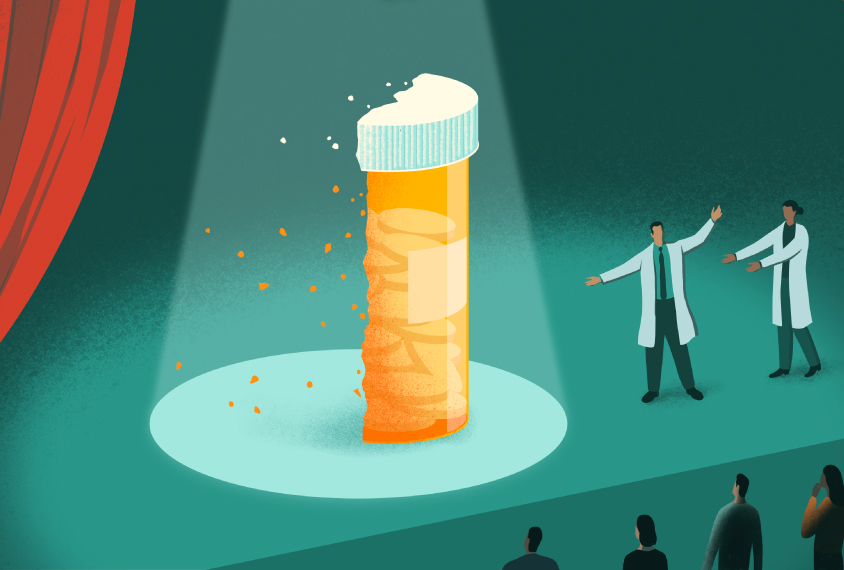 An illustration of a scientist on a stage with a giant pill bottle that has been chopped in half.