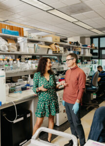 Autism researcher Veronica Martinez Cereno and her husband in her lab