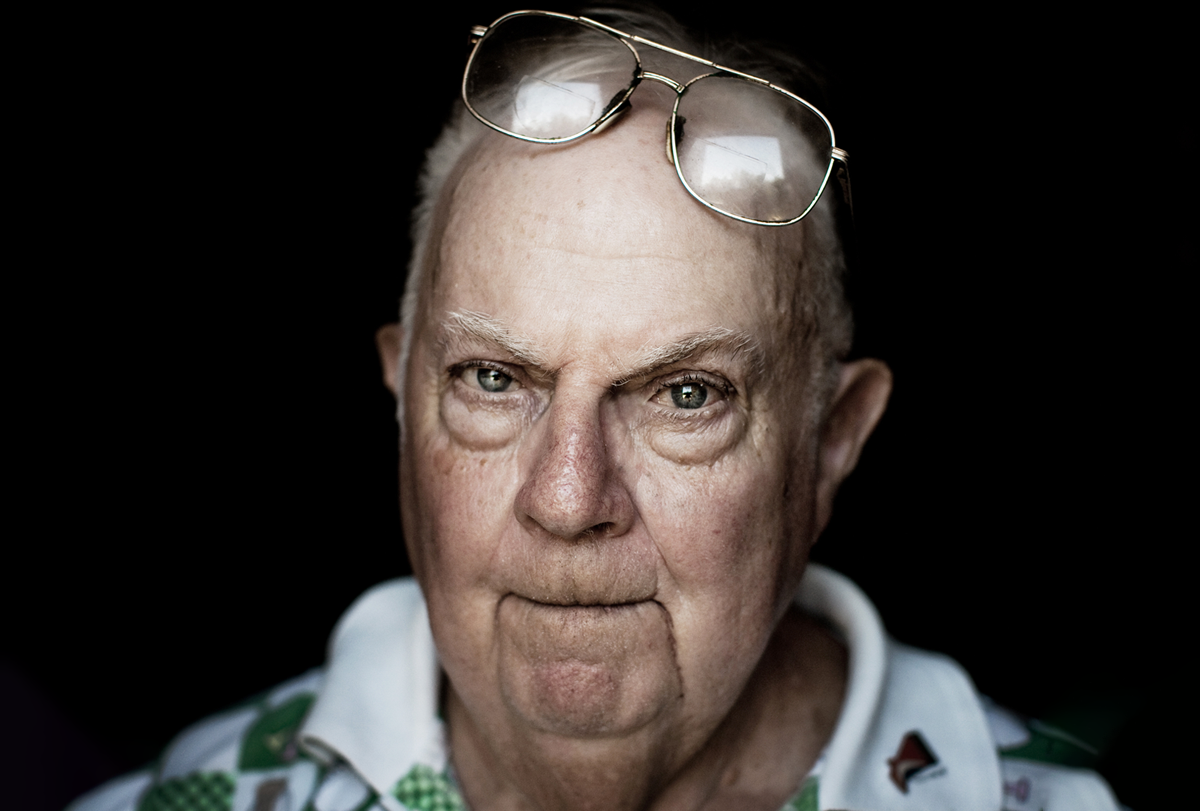 Portrait photograph of Donald Triplett against a black background.