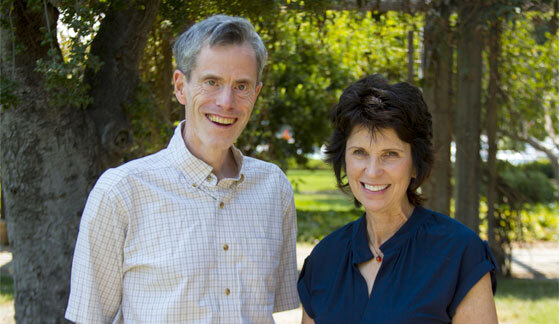 Tristram Smith and Connie Kasari stand outdoors smiling.