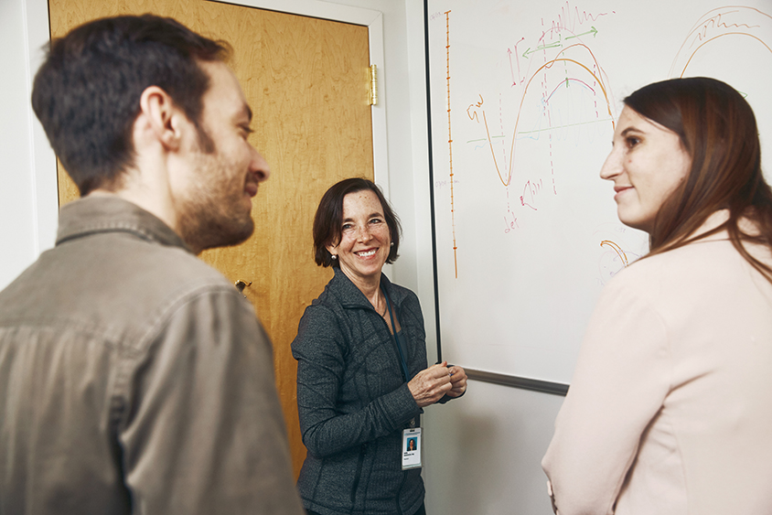 Dara Manoach discusses results with team members Dimitrios Mylonas and Paige Hickey.