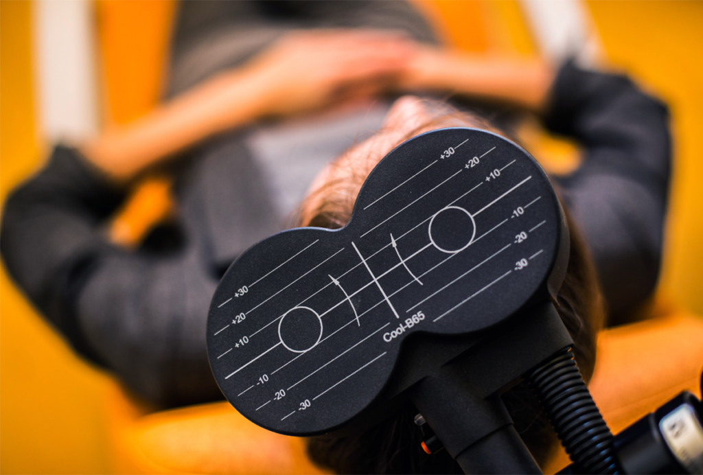 A patient receives transcranial magnetic stimulation.