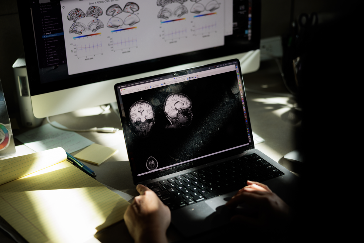 Christine Wu Nordahl looks at brain scans in her office at the UC Davis MIND Institute in Sacramento, California on April 21. 2023.