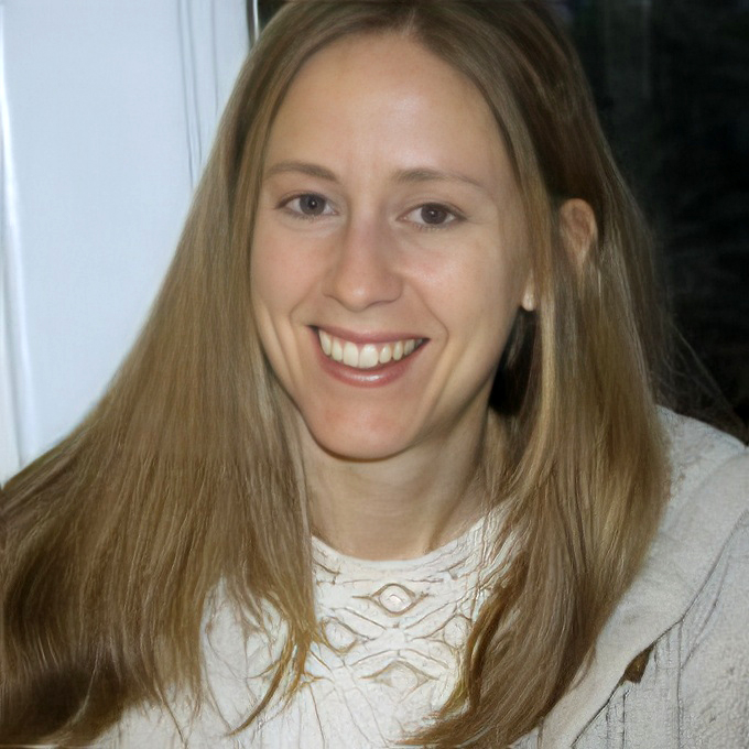 Headshot of writer Sarah DeWeerdt, a white woman with blonde hair in a cream colored top.