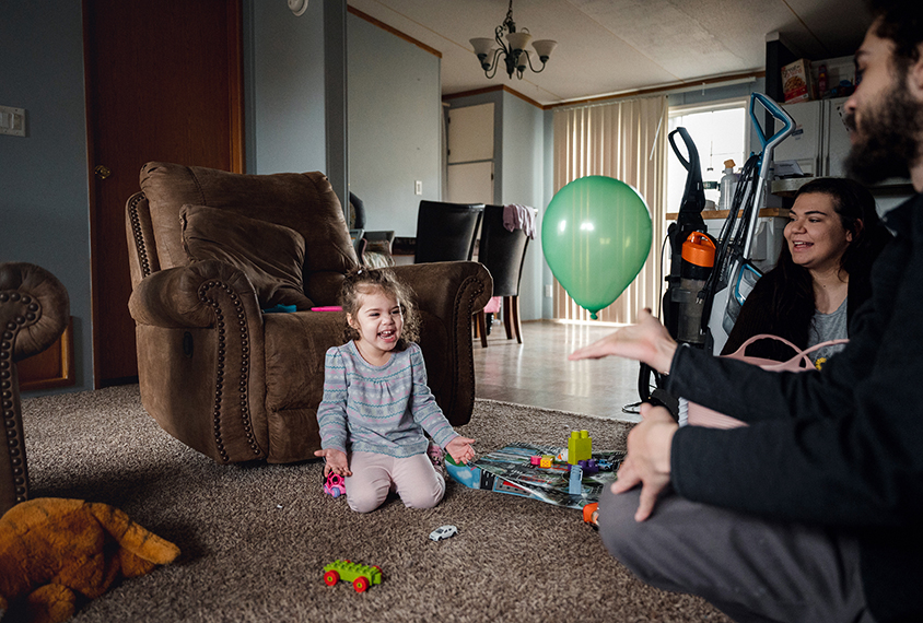 Coraline plays with a balloon in her home in Pennsylvania.
