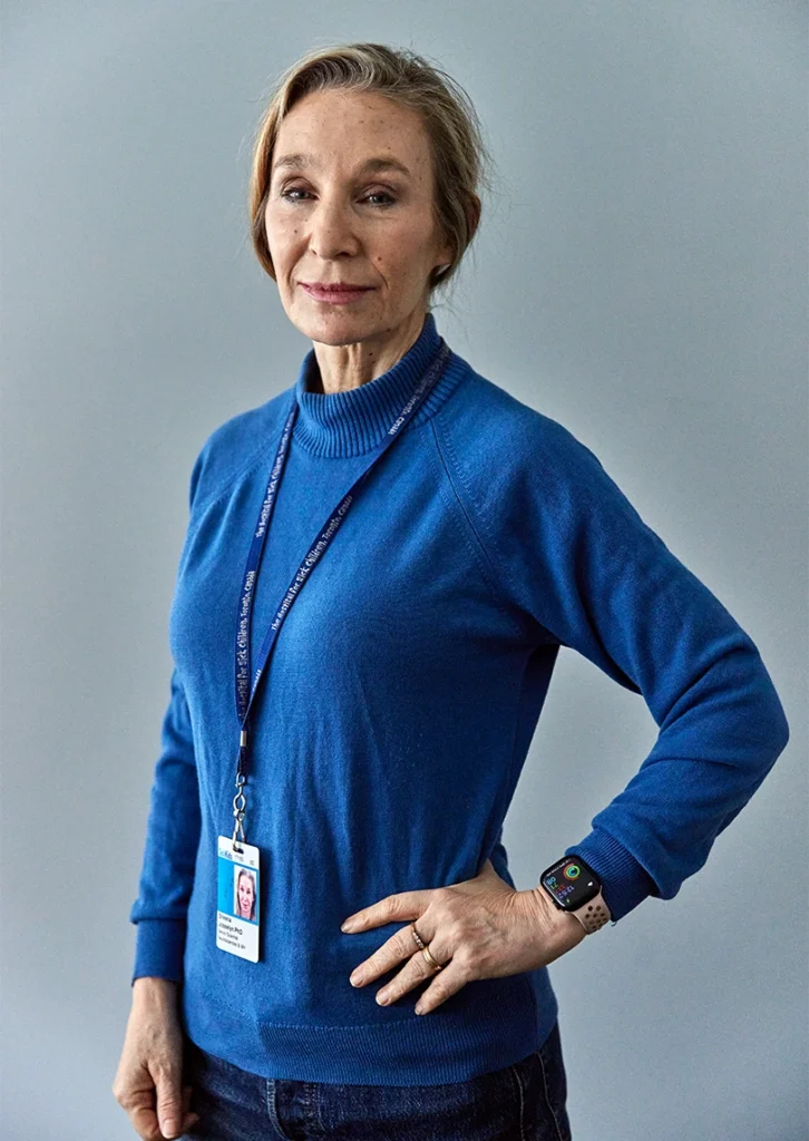 Portrait of scientist Sheena Josselyn in a blue sweater. 
