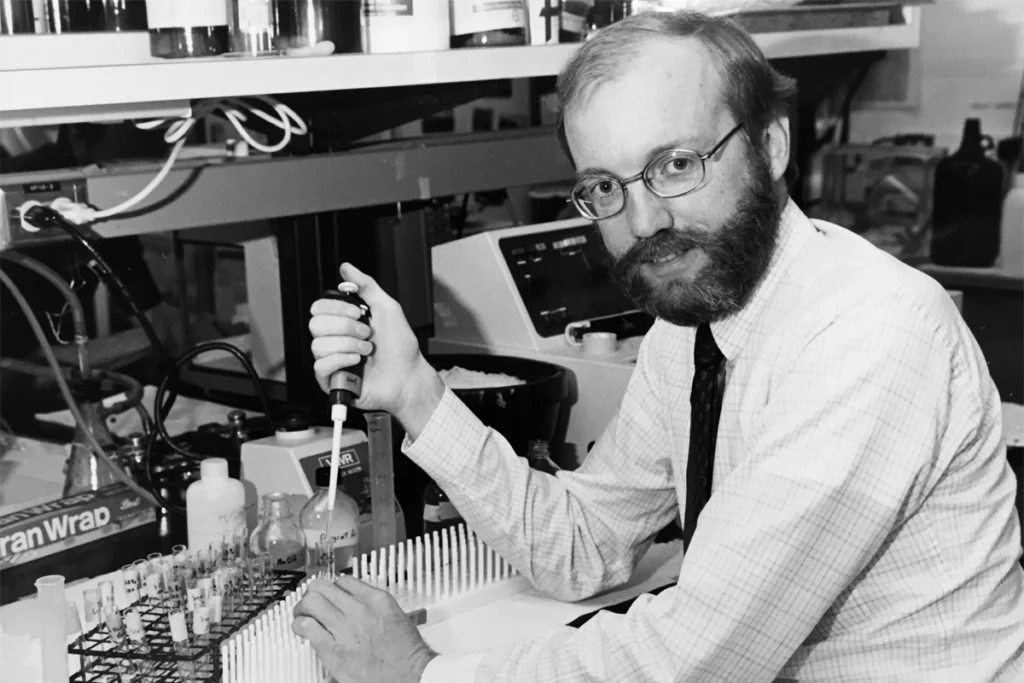 Black-and-white photograph of William Catterall in a lab.