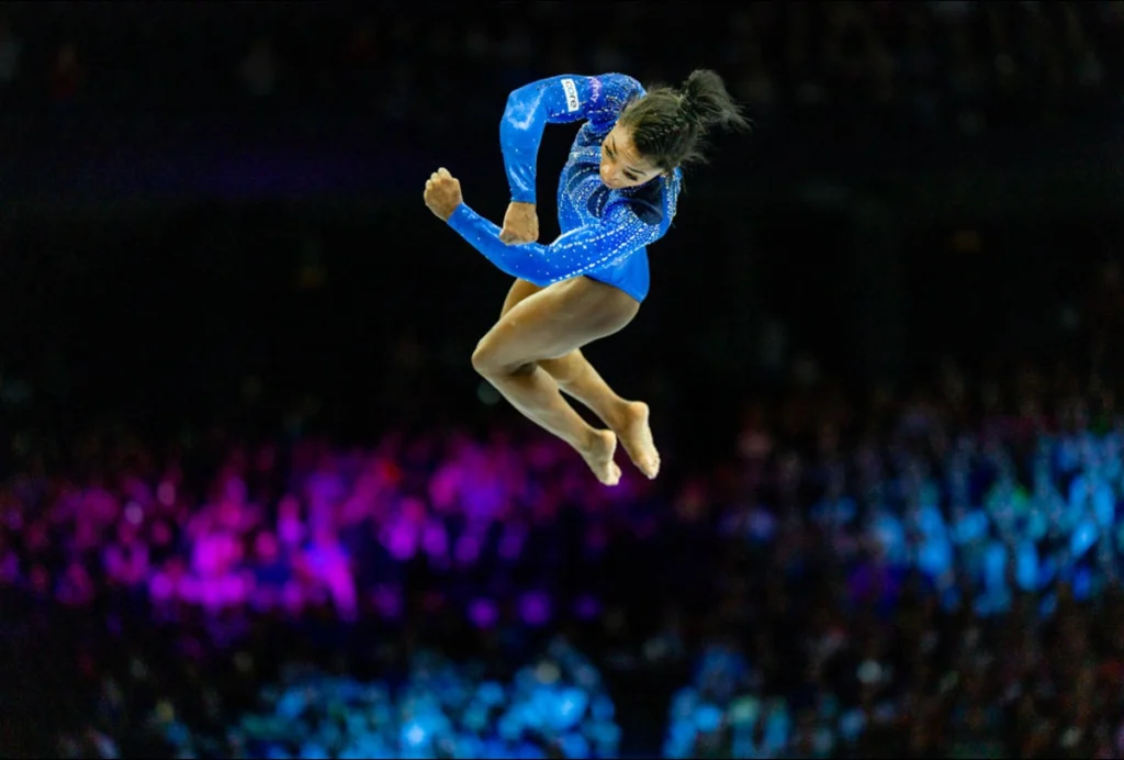 Photograph of Simone Biles vaulting at the Summer 2020 Olympics.