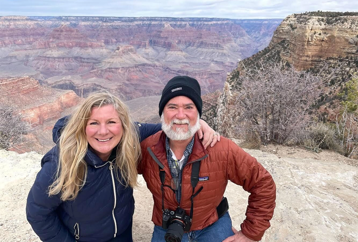 Anne Murphy and Larry Young in front of a grand canyon.