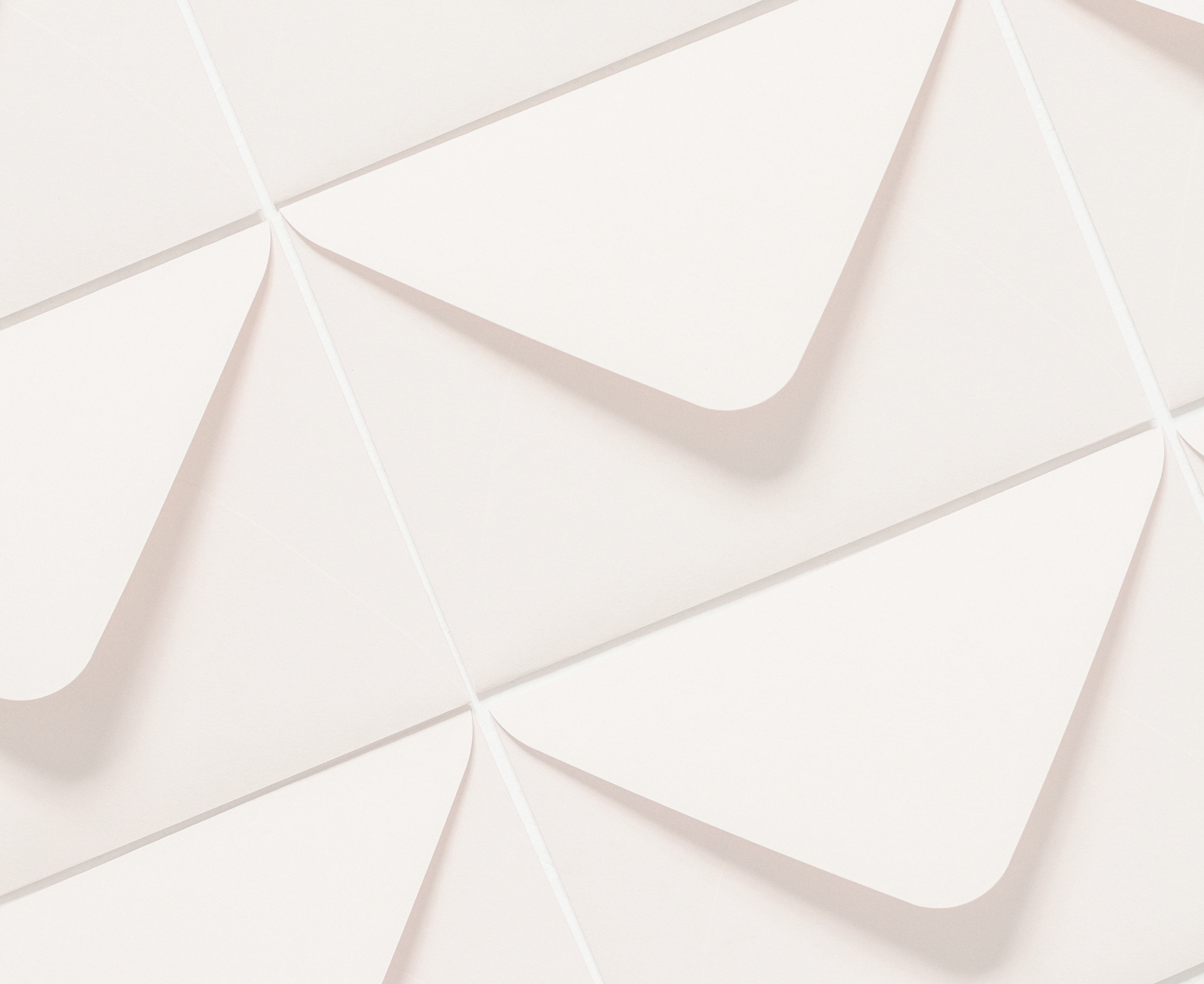 Decorative background of a grid of pale yellow envelopes.