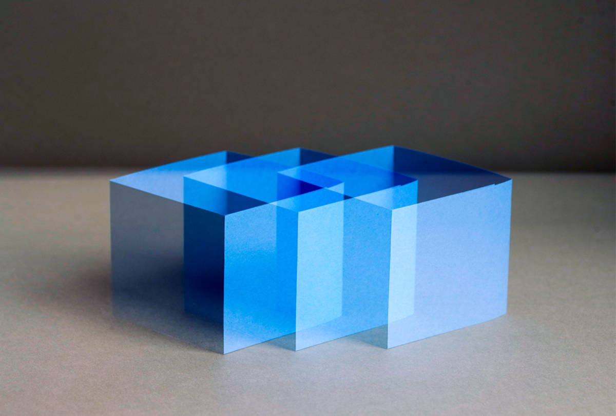 An opaque cube is repeated multiple times to create the appearance of overlapping cubes.