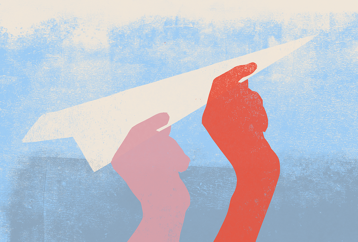 Two hands hold a paper airplane.